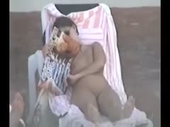 My concealed camera captures a nude brunette woman.